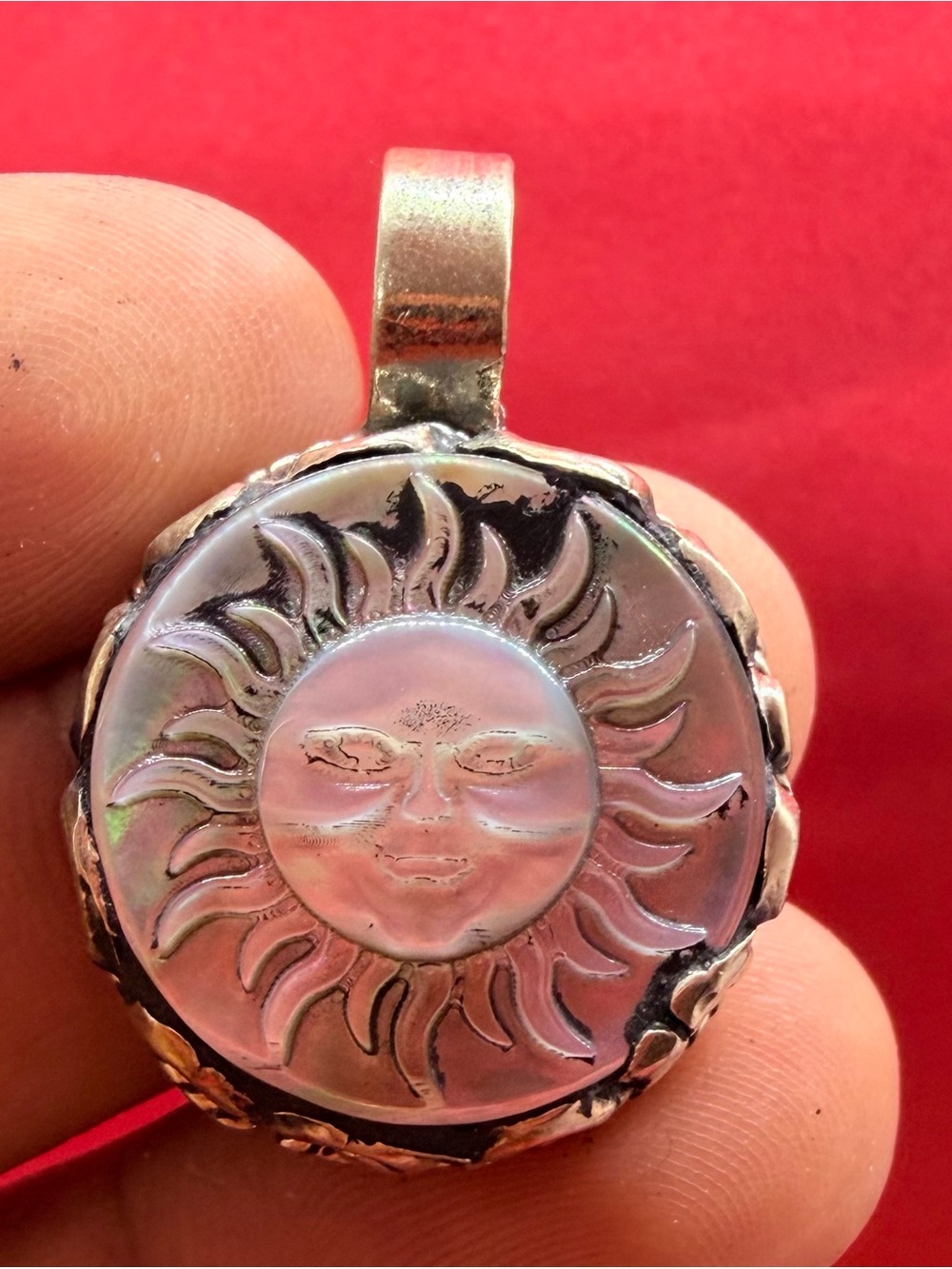 Tibetan Silver Pendant Featuring A Carved Sun Face Set In Iridescent Pearl Amule